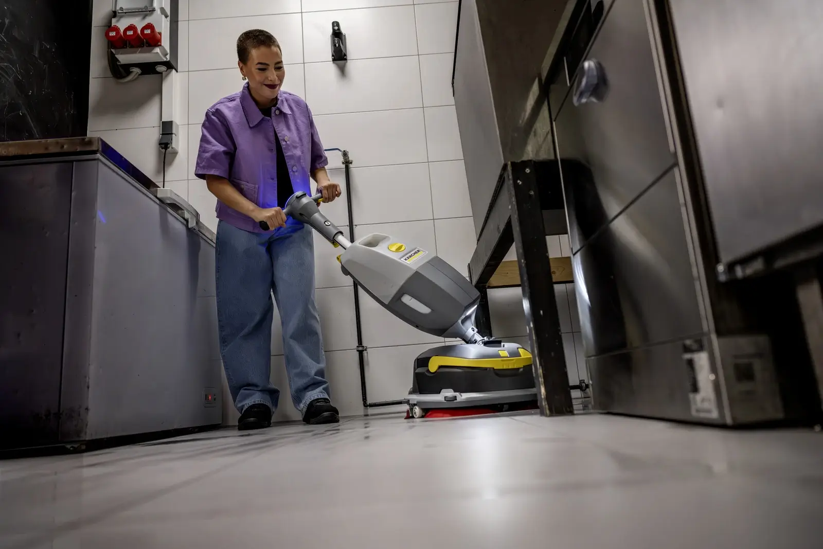 Cleaning staff using the K-Mop 46 Bp in a professional kitchen